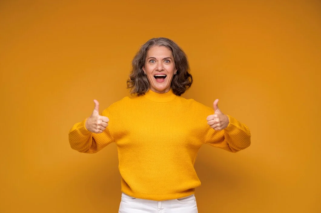 Happy woman with fingers up for top result